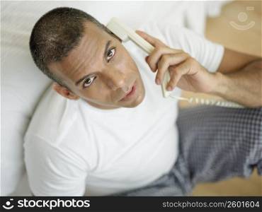 Portrait of a mid adult man talking on the telephone