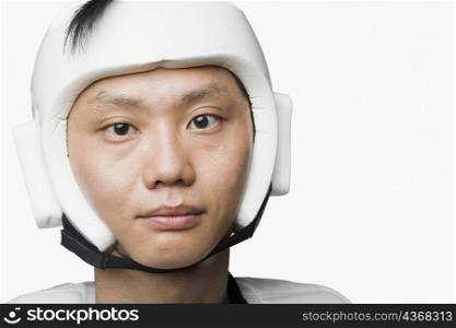 Portrait of a mid adult man wearing a sports helmet