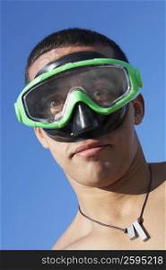 Portrait of a mid adult man with a swimming goggles