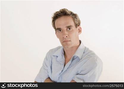 Portrait of a mid adult man with his arms folded