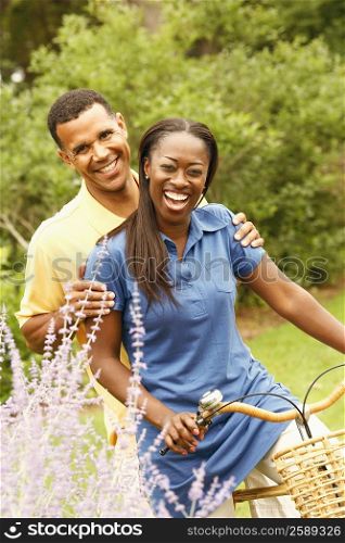 Portrait of a mid adult woman and a mature man cycling