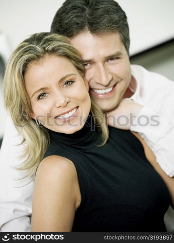 Portrait of a mid adult woman and a mature man smiling