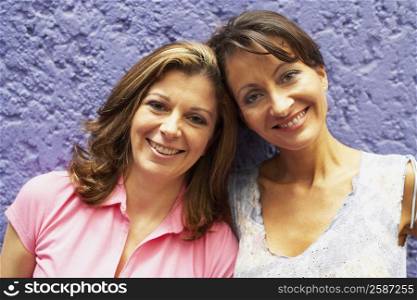 Portrait of a mid adult woman and a mature woman smiling