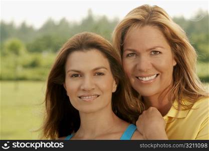 Portrait of a mid adult woman and a mature woman smiling