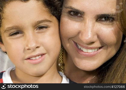 Portrait of a mid adult woman and her son smiling