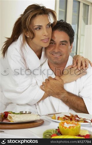Portrait of a mid adult woman embracing a mid adult man