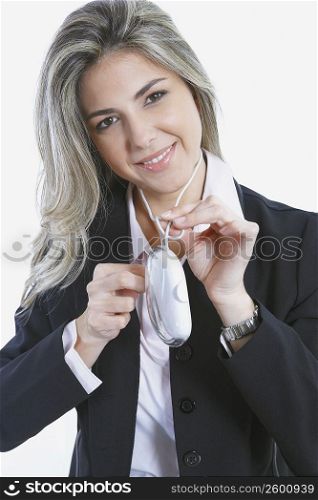 Portrait of a mid adult woman holding a computer mouse and smiling