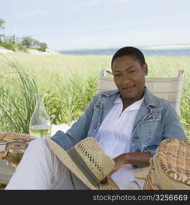 Portrait of a mid adult woman holding a glass of wine and smiling