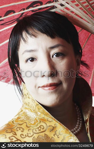 Portrait of a mid adult woman holding a parasol