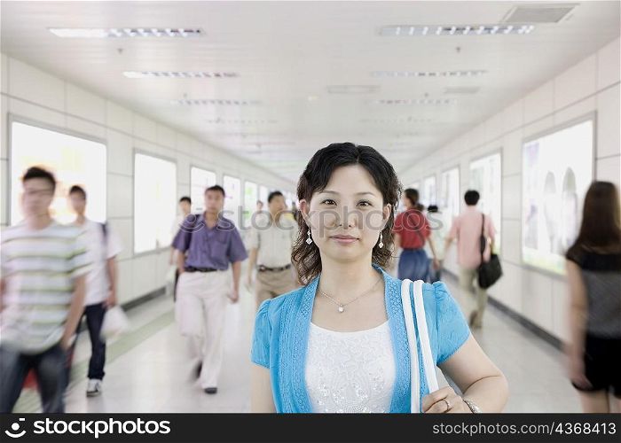 Portrait of a mid adult woman in a corridor