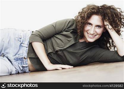 Portrait of a mid adult woman lying on the floor