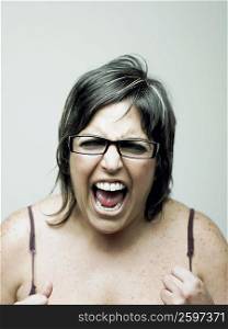 Portrait of a mid adult woman shouting