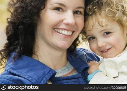 Portrait of a mid adult woman smiling with her daughter