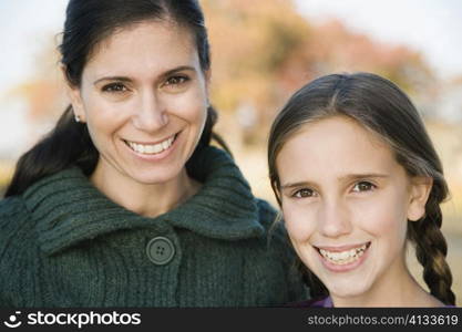 Portrait of a mid adult woman smiling with her daughter