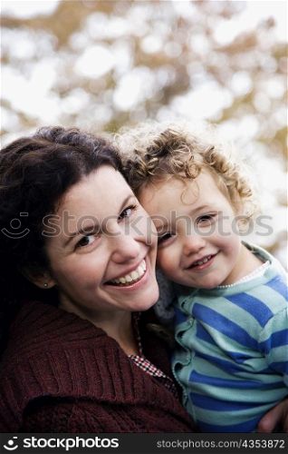 Portrait of a mid adult woman smiling with her daughter