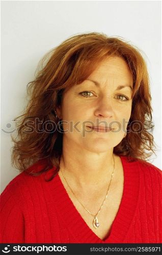 Portrait of a mid adult woman smirking