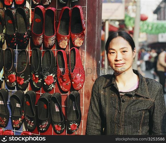 Portrait of a mid adult woman standing in a shoe store