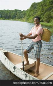 Portrait of a mid adult woman standing on a boat and smiling