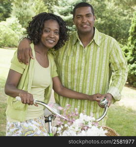 Portrait of a mid adult woman standing with a mature man and smiling