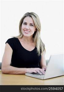 Portrait of a mid adult woman using a laptop