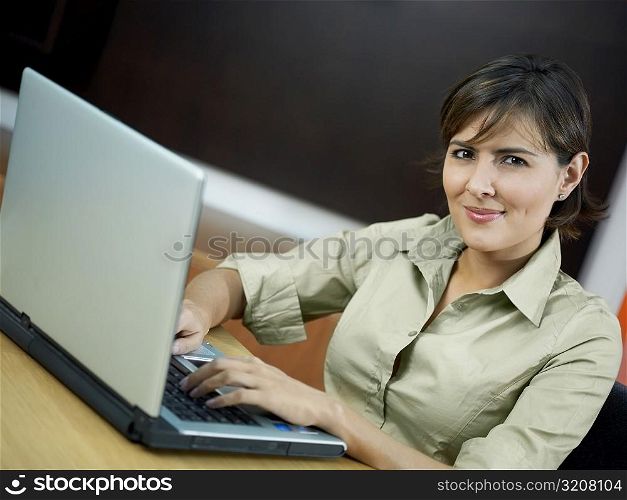 Portrait of a mid adult woman using a laptop