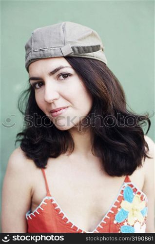 Portrait of a mid adult woman wearing a cap