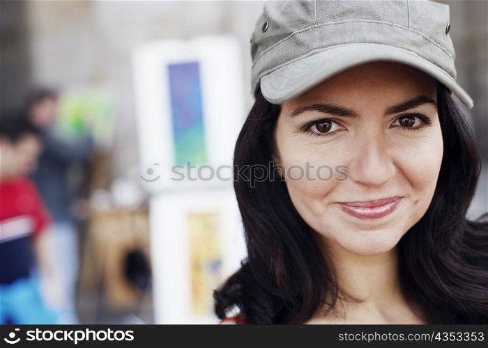 Portrait of a mid adult woman wearing a cap