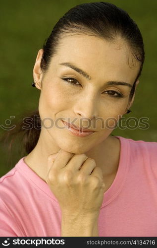 Portrait of a mid adult woman with her hand on her chin