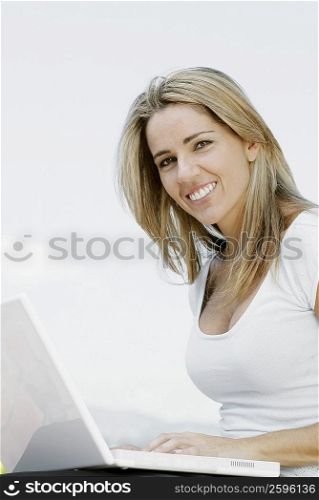 Portrait of a mid adult woman working on a laptop