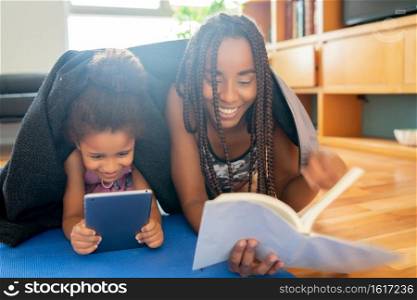 Portrait of a mother and daughter spending time together while staying at home. Monoparental concept. New normal lifestyle concept.