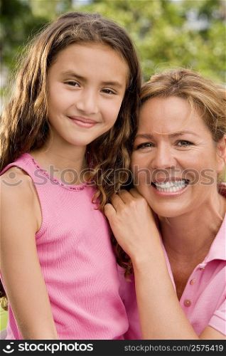 Portrait of a mother and her daughter smiling