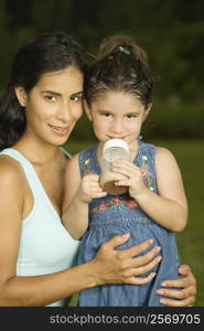 Portrait of a mother holding her daughter