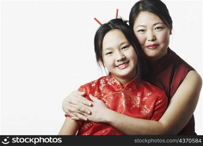 Portrait of a mother hugging her daughter