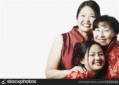 Portrait of a mother with her daughter and granddaughter smiling