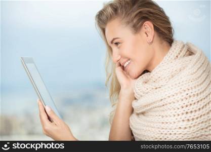 Portrait of a nice happy girl communicate with friends on the touchpad, using modern technology for communication with relatives from another countries