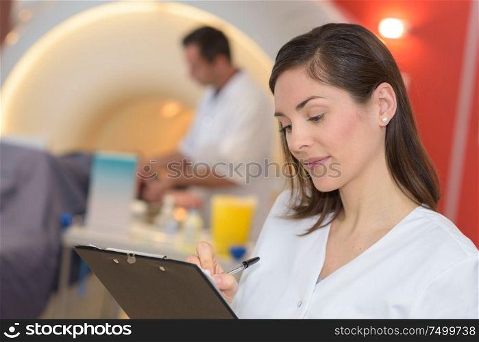 portrait of a nurse with clipboard in the retirement house