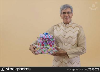 Portrait of a old man holding gifts