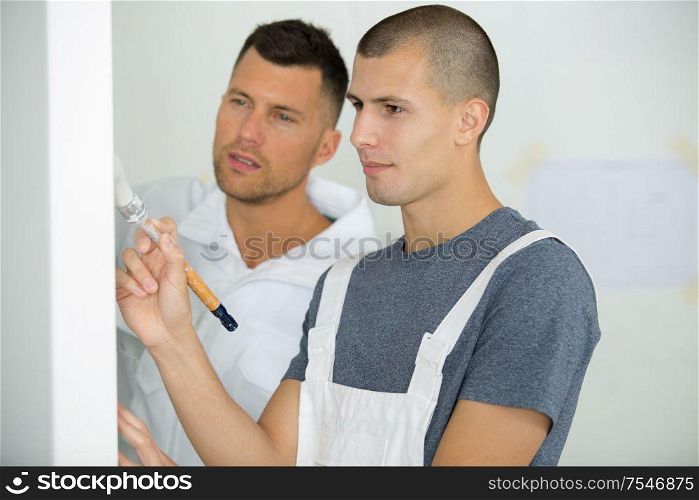 portrait of a painter with an apprentice