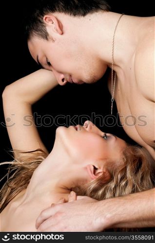 Portrait of a passionate beautiful young couple. Isolated
