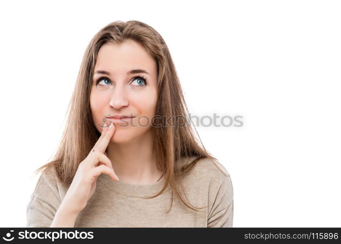 portrait of a pensive dreamy girl on a white background