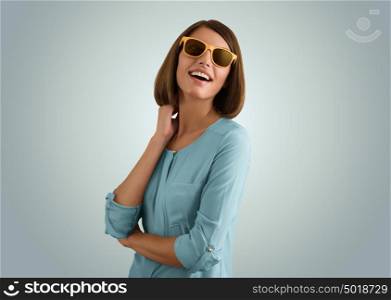 Portrait of a positive girl wearing sunglasses