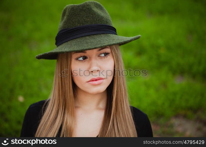 Portrait of a pretty girl wearing hat