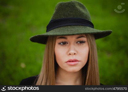 Portrait of a pretty girl wearing hat