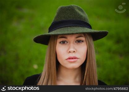Portrait of a pretty girl wearing hat