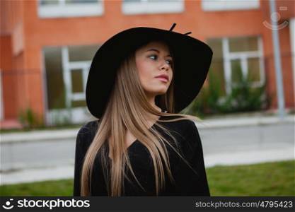 Portrait of a pretty girl wearing stylish hat