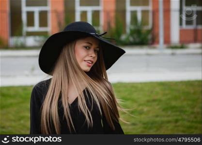 Portrait of a pretty girl wearing stylish hat