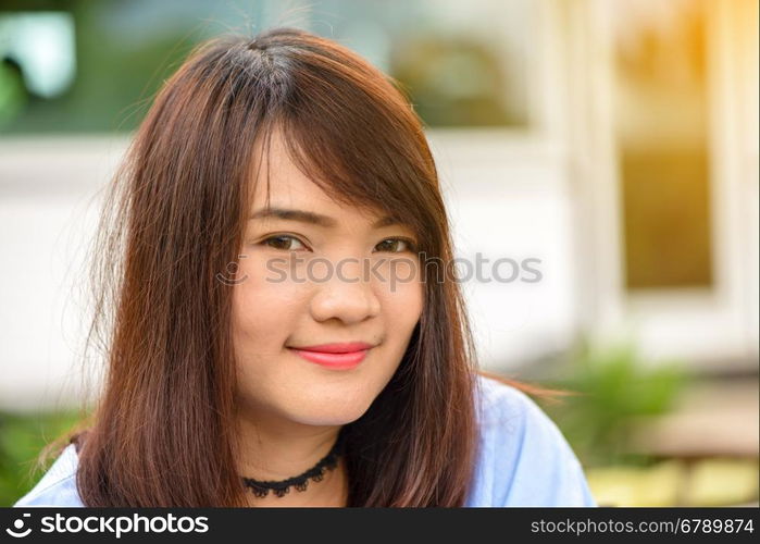 Portrait of a pretty happy woman, smiling