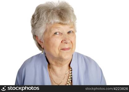 Portrait of a pretty, smiling senior lady against a white background.