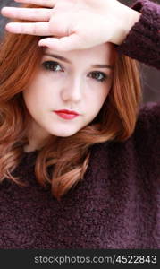 Portrait of a pretty teenage girl with redhair