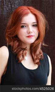 Portrait of a pretty teenage girl with redhair